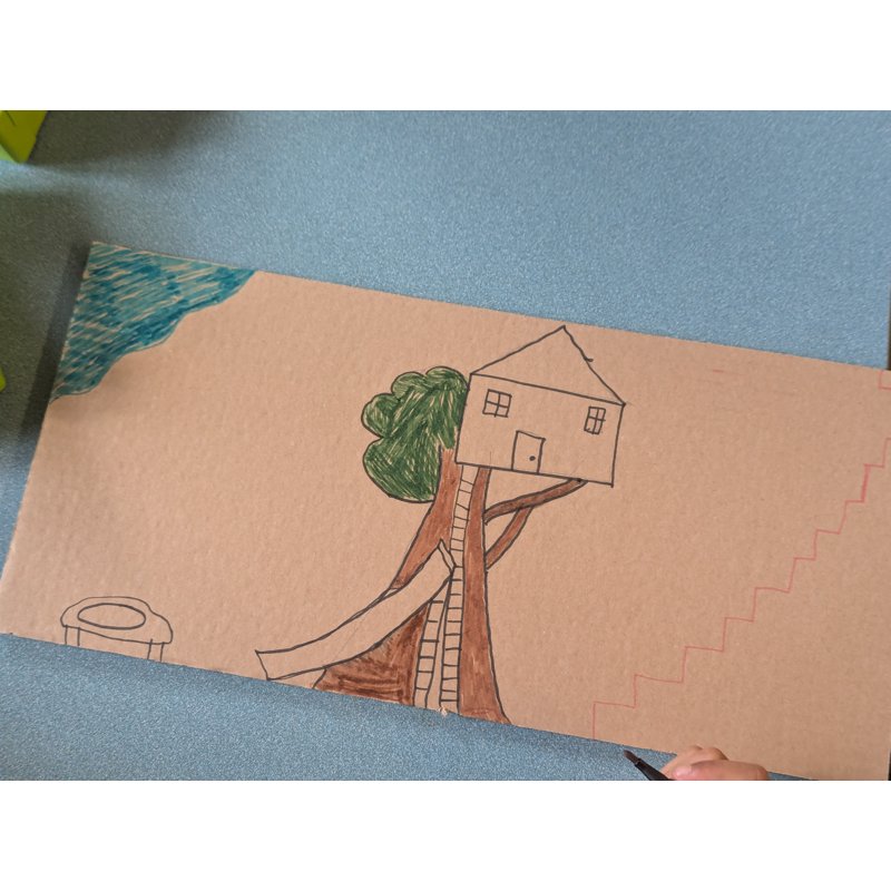 100 Stories drawn floor on cardboard
