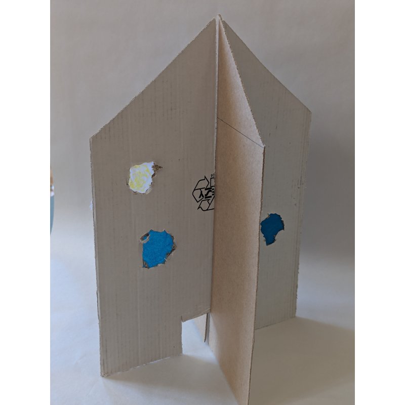 A child's cardboard interlocking house